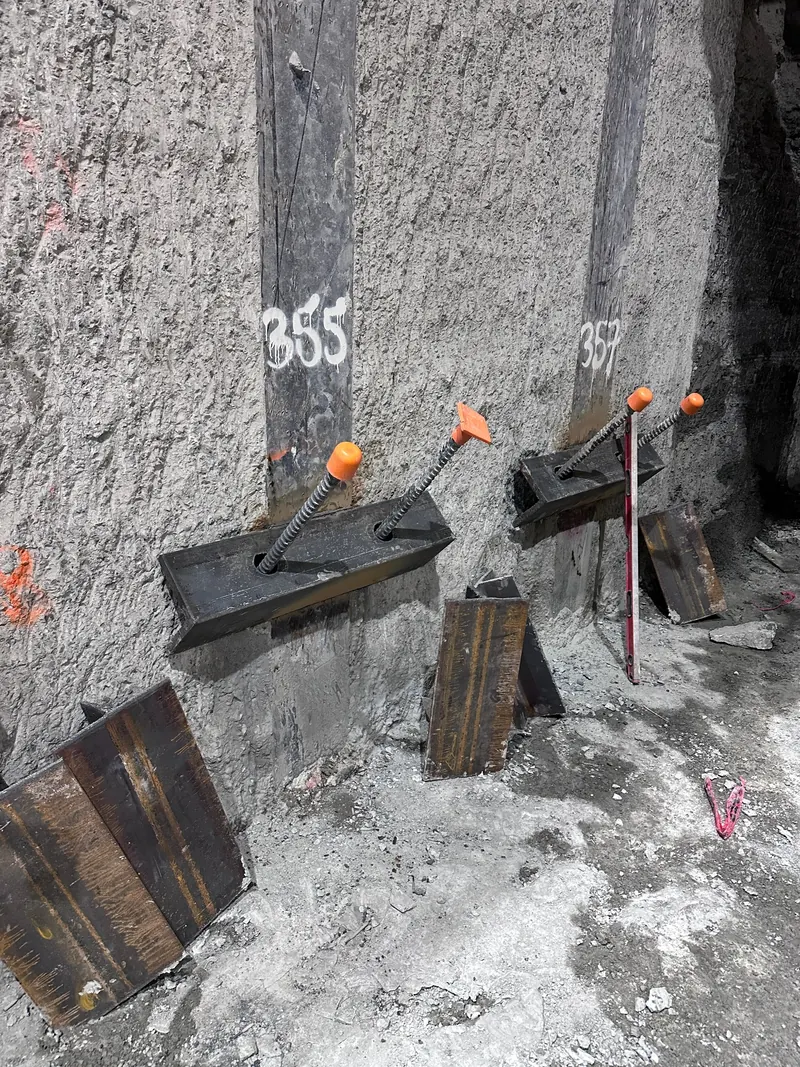 Close-up of steel support chairs attached to H-piles