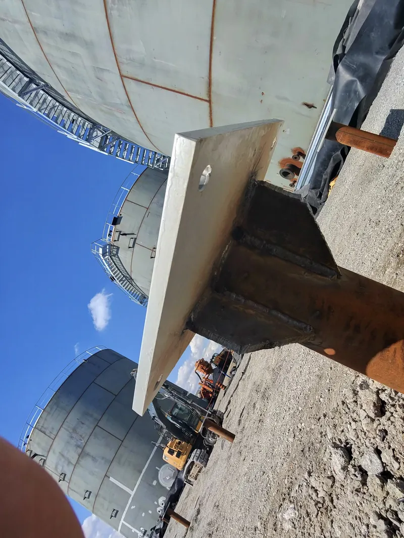 Welded pile cap and gusset plates on a round steel pipe pile