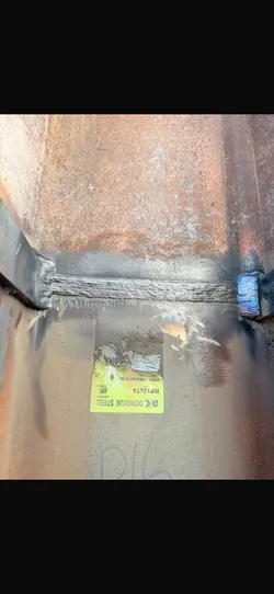 Field-welded structural steel beam splice completed by Riconstruct